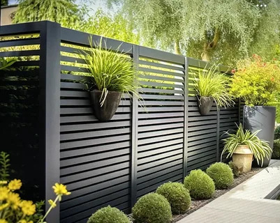 Affordable black horizontal slat fence with modern landscaping and elegant privacy screening