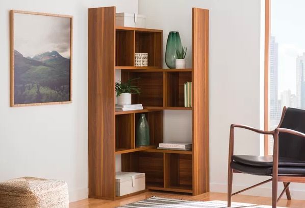 Modern wooden corner bookshelf for apartment storage and stylish small space organization.