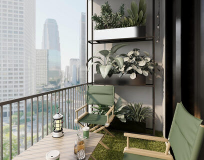 Small apartment balcony decor with cozy chair, plants, and modern shelving overlooking a city skyline.