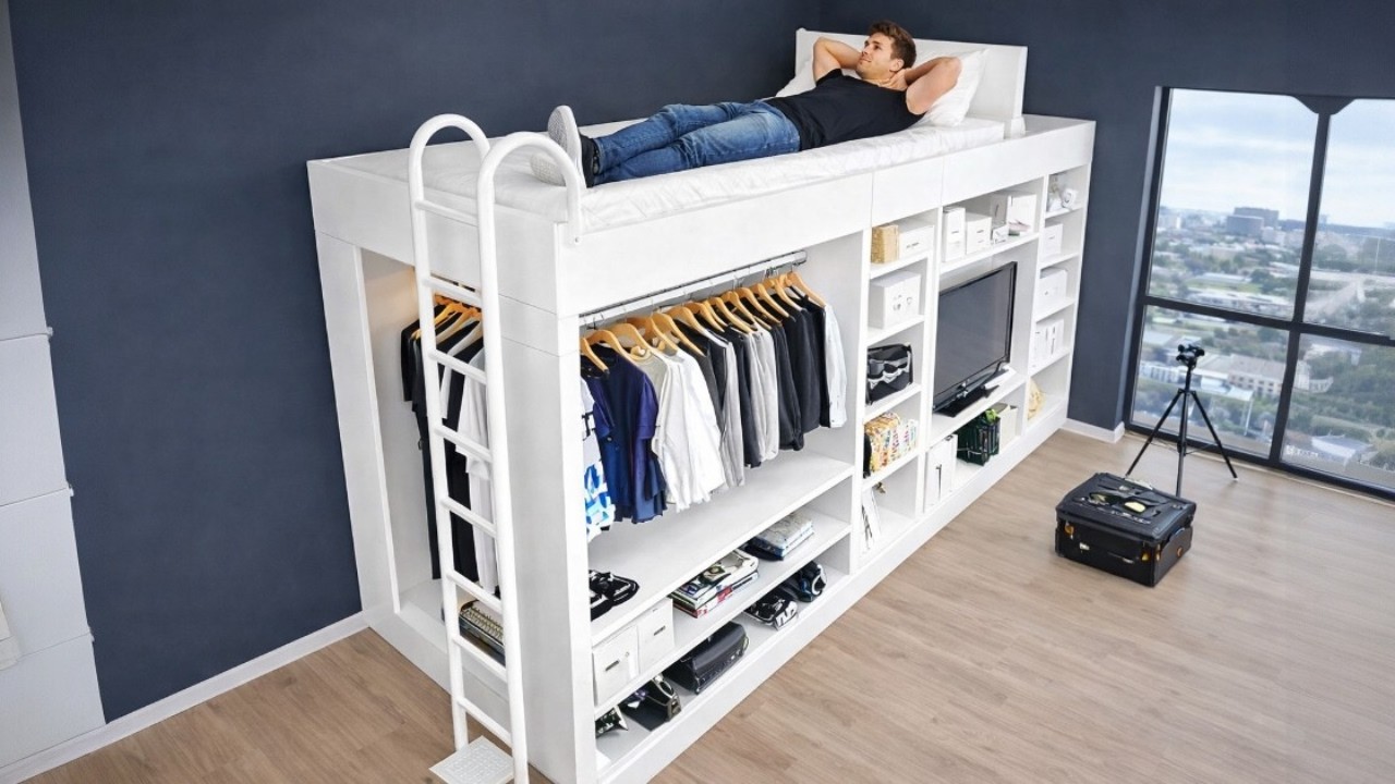 Loft bed with built-in shelves and clothing storage maximizing space in a tiny apartment bedroom.