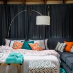 Stylish temporary home decor setup with layered bedding, cozy lighting, and removable decorative accents in a modern apartment.