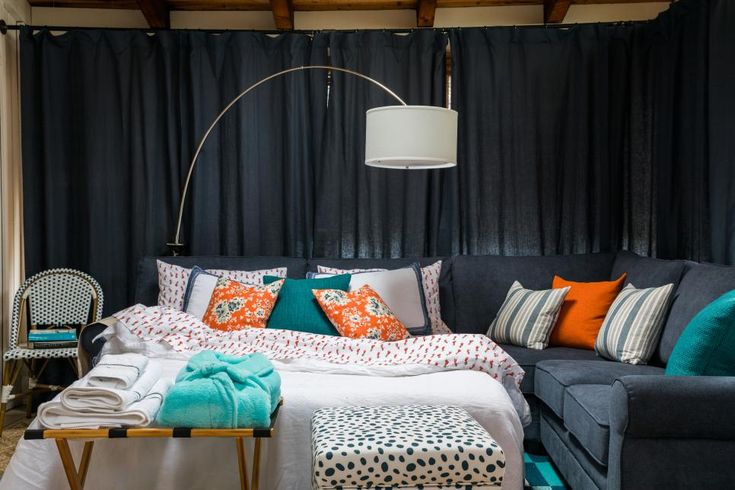 Stylish temporary home decor setup with layered bedding, cozy lighting, and removable decorative accents in a modern apartment.