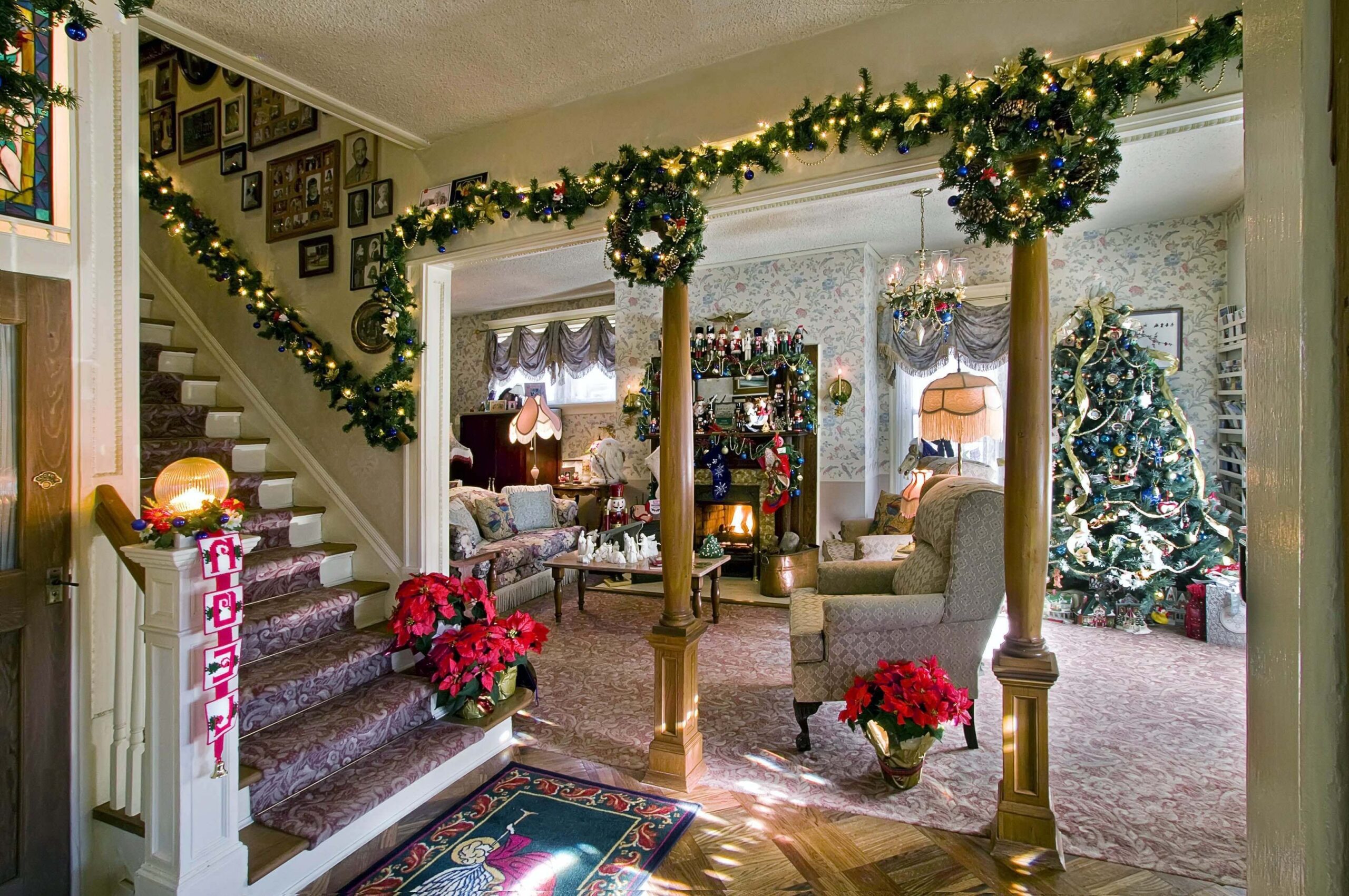 Elegant January living room decorated with garlands, winter greenery, and cozy seasonal accents near the staircase.