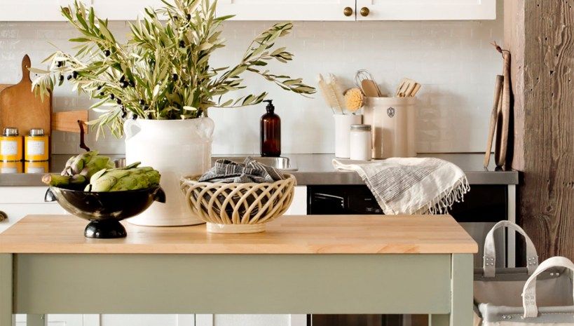 Minimalist kitchen counter decorated with temporary greenery and modern renter-friendly decor accents.