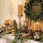 Elegant January mantel decorations with candles, greenery, and neutral winter home decor accents.