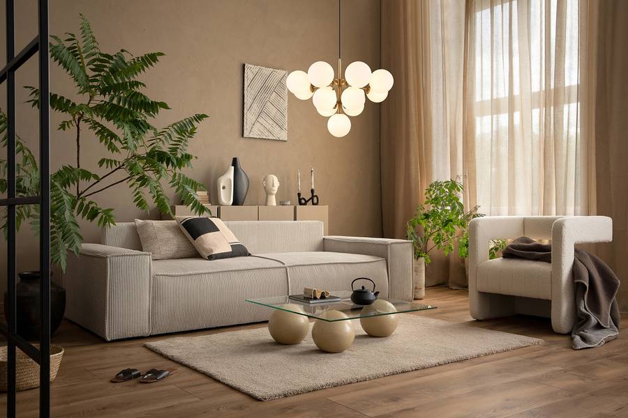 Cozy neutral living room with temporary home decor accents, soft lighting, and indoor plants for a calming atmosphere.