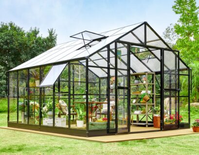 Stylish backyard greenhouse with solar lighting system for sustainable gardening and lower power consumption.