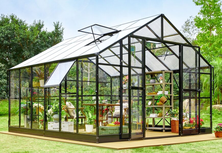 Stylish backyard greenhouse with solar lighting system for sustainable gardening and lower power consumption.