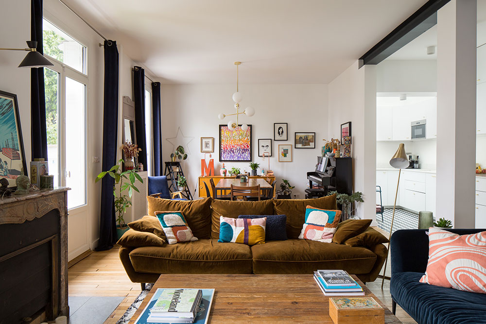 Modern Parisian apartment interior with warm colors, vintage furniture, and stylish European decor accents.