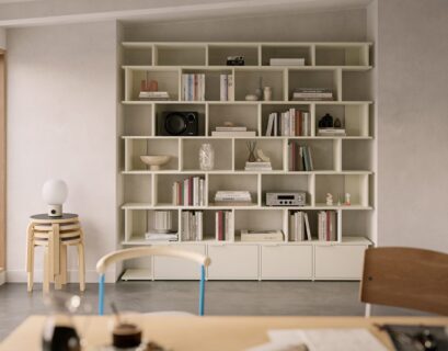 Modern apartment wall storage with built-in shelving and minimalist decor for maximizing small living spaces.