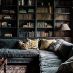 Dark academia living room with vintage bookshelves, leather sofa, and moody classic decor