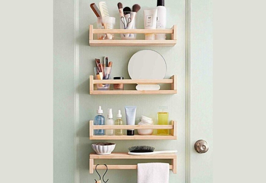Small bathroom shelves beside door with toiletries, baskets, and space-saving storage